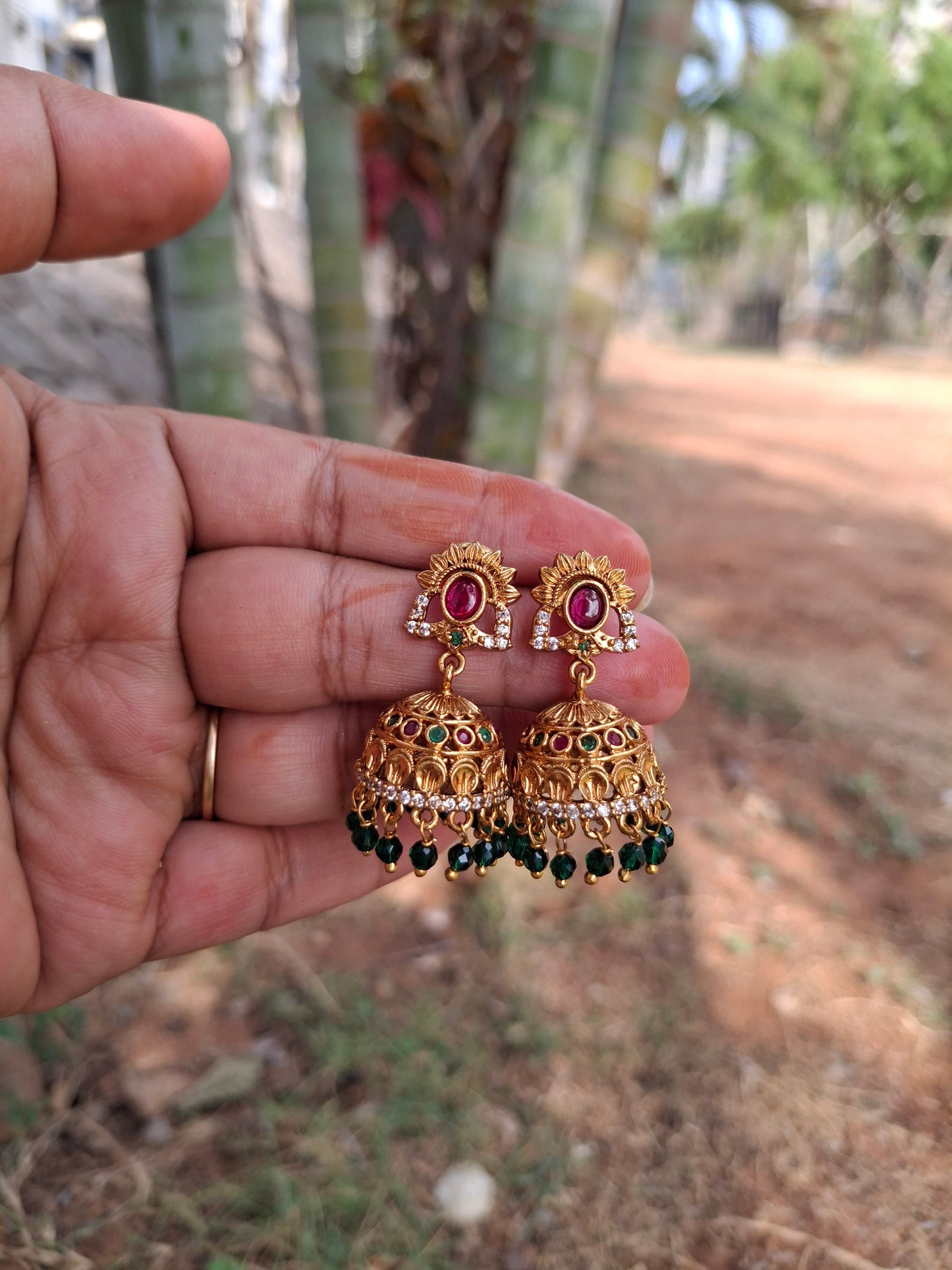 Traditional Gold-Plated Jhumka Earrings with Colorful Stones