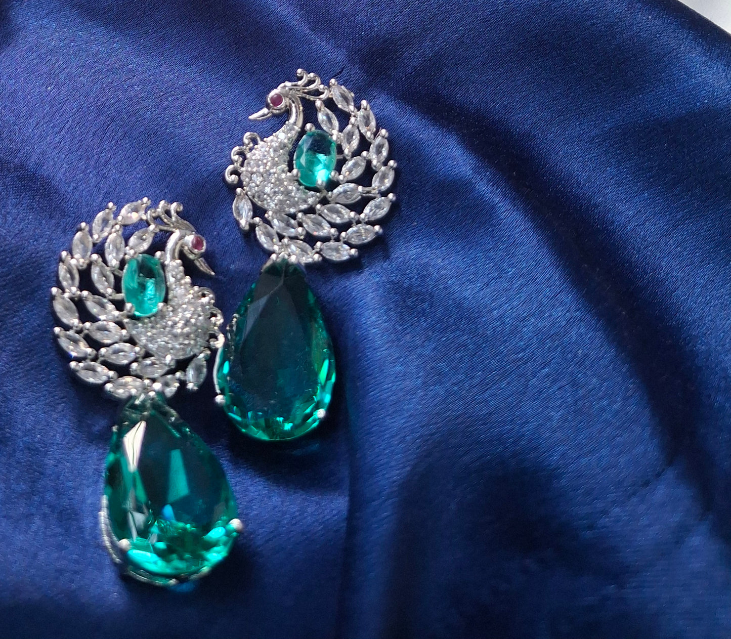 Elegant Silver Peacock Earrings with Emerald Green Drops