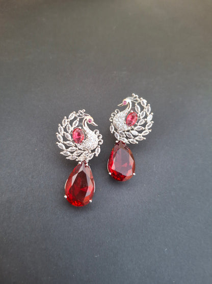 Regal Silver Peacock Earrings with Ruby Red Teardrops