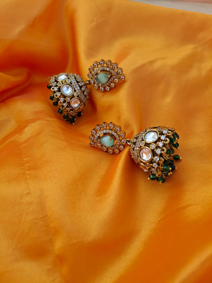 Gold-Plated Jhumka Earrings with Pastel Green, White, and Dark Green Stones
