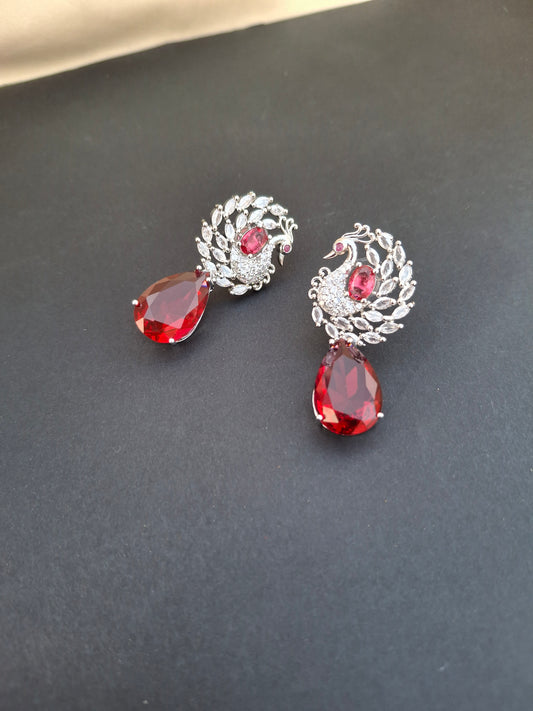 Regal Silver Peacock Earrings with Ruby Red Teardrops