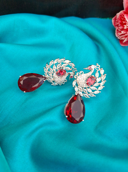 Regal Silver Peacock Earrings with Ruby Red Teardrops
