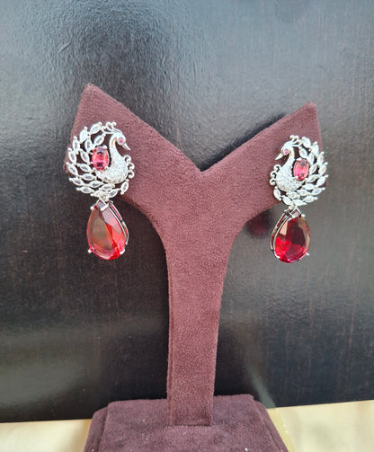 Regal Silver Peacock Earrings with Ruby Red Teardrops