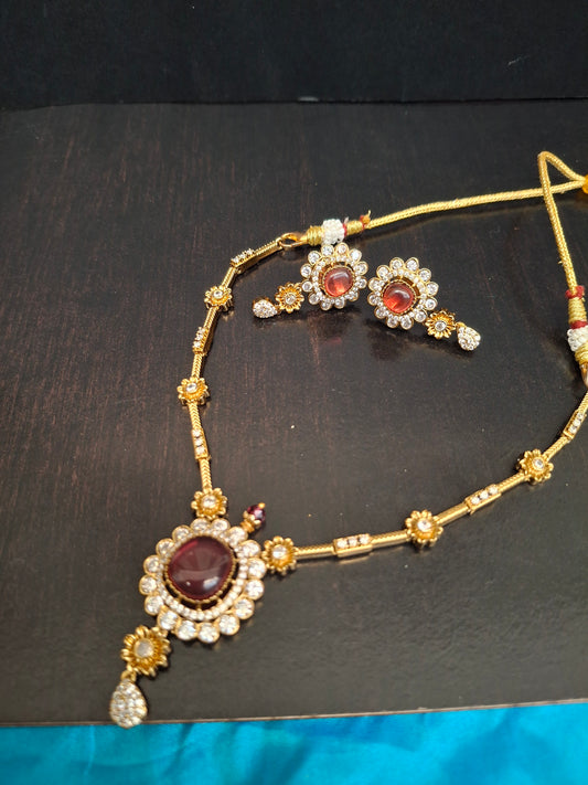 Elegant Pink Kundan Circular Pendant Set with Earrings
